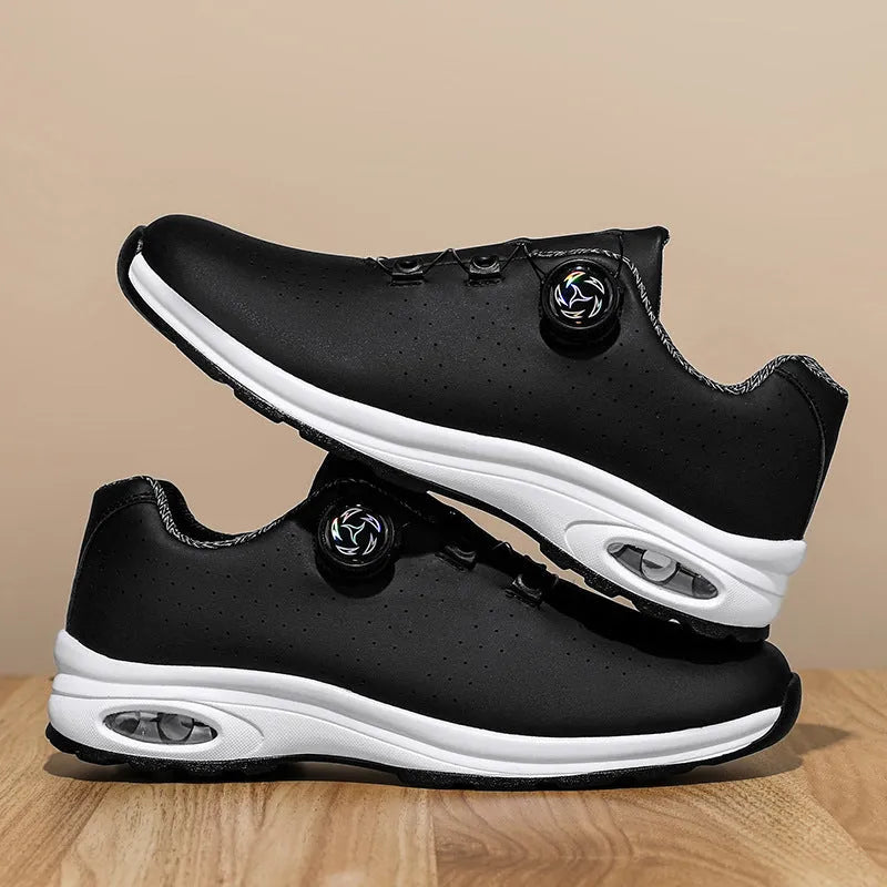Black and white low top mesh casual shoes with lace-up front and cross shoulder straps on a composite sole.