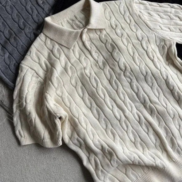 Man's grey twisted knit cotton style short sleeve T-shirt on a hanger