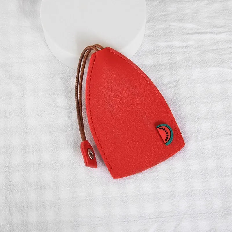 Cartoon pull-out key case in PU leather measuring 14 x 7.5 cm with colourful designs