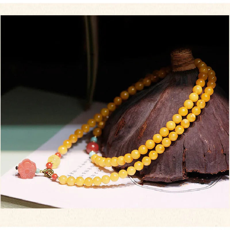 Yellow chicken grease beeswax amber bracelet with animal zodiac design in retro style