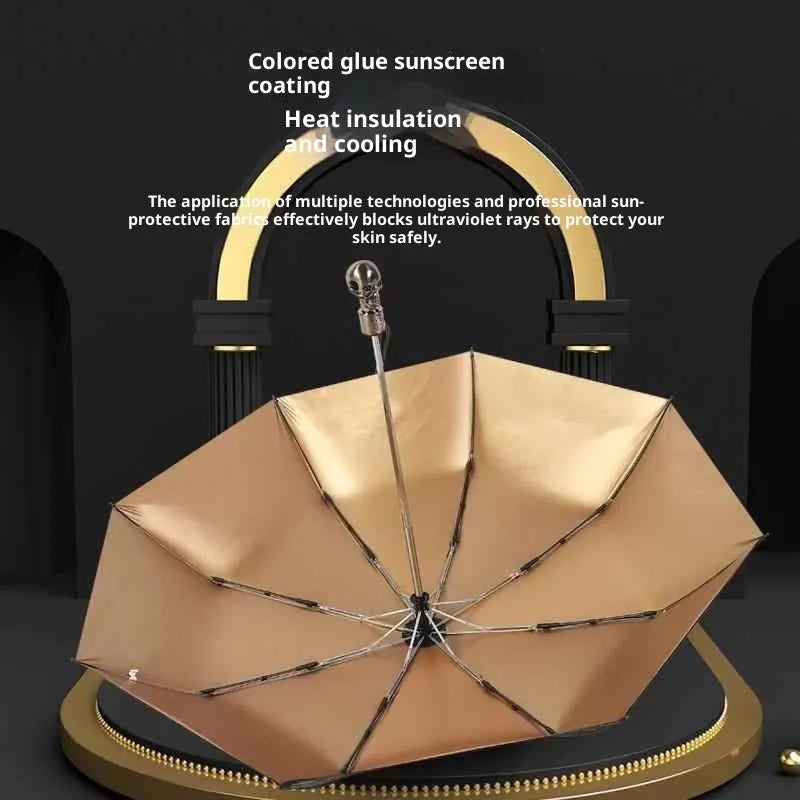 Three-fold automatic skull umbrella with black gold capsules colour, 100cm diameter, and steel handle