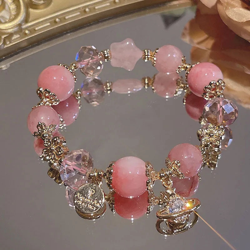 Women's galaxy-coloured alloy bracelet with a snowflake pendant and sweet bow design.