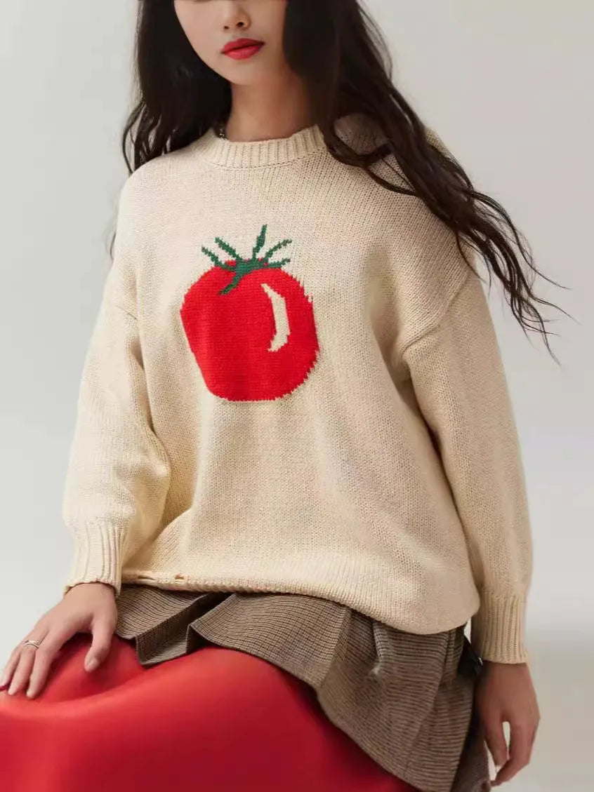 Milky white women's jacquard knit pullover sweater with a round neck and long sleeves on a hanger.