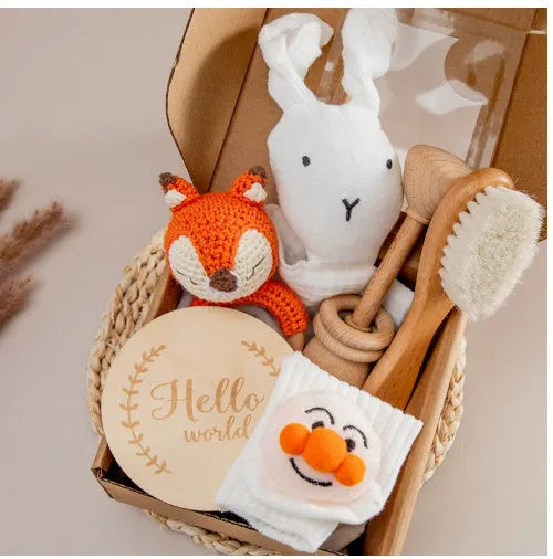Baby teething gift set with wooden toys and large bamboo-cotton gauze blanket in assorted colours