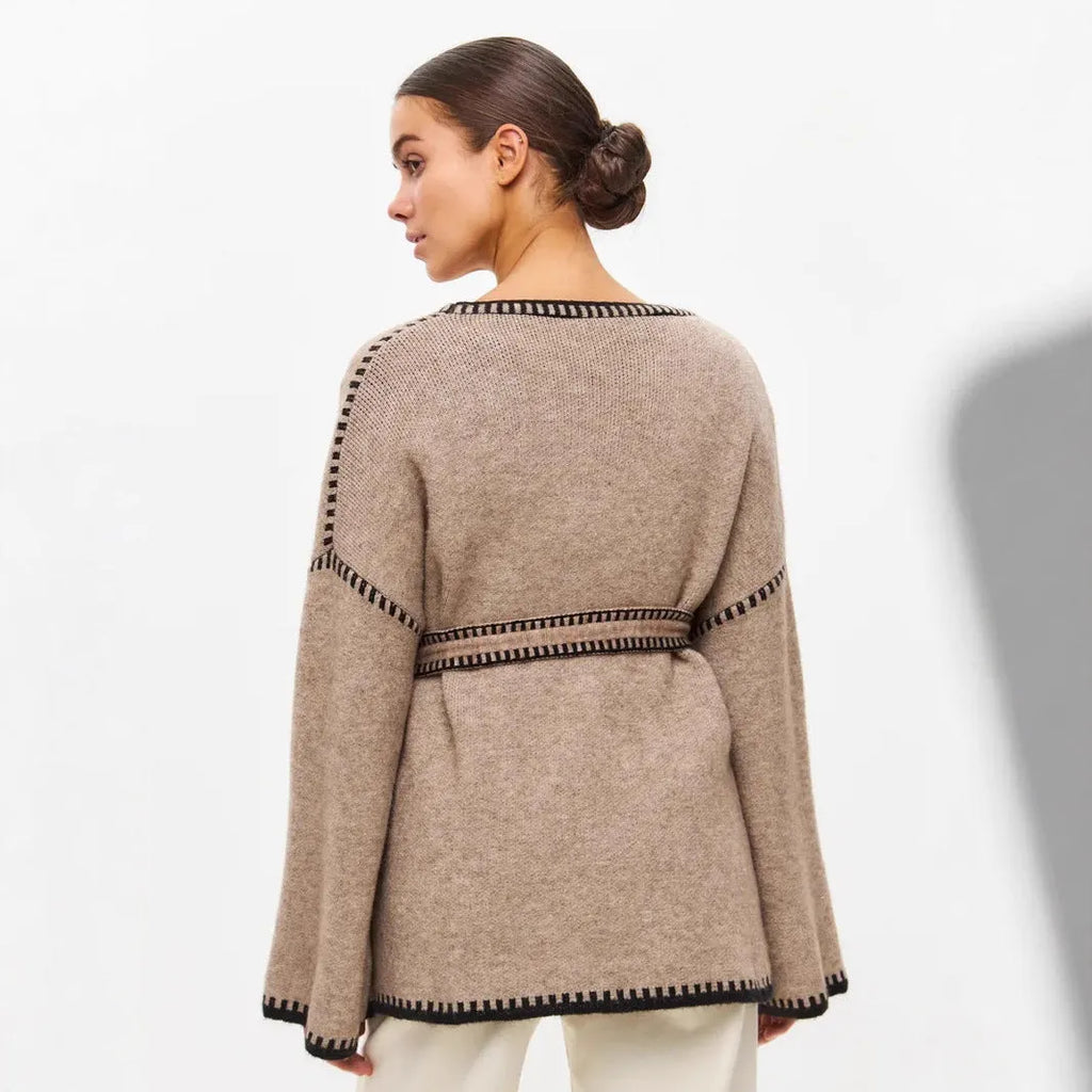 Loose mid-length knitted cardigan with lace-up front, in white, black, or camel.