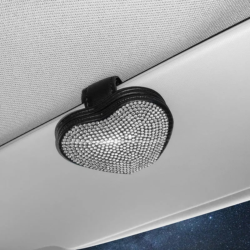 Black PU leather car sun visor clip with diamond accents holding sunglasses and a ticket.