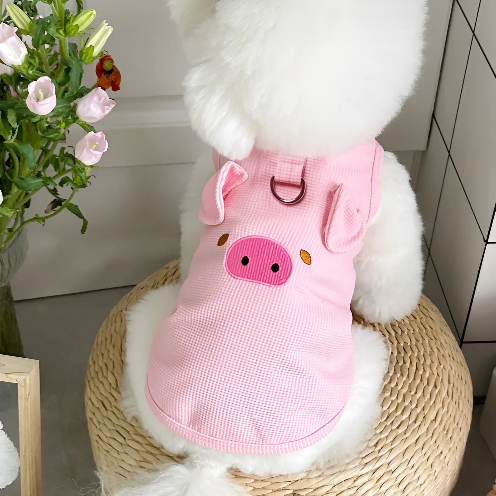 A yellow waffle-textured dog vest lying flat, showing its simple vest shape and knit pattern.
