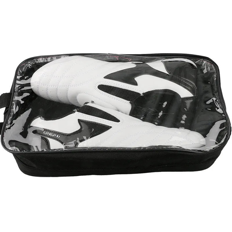 Black and white children's Sanda Taekwondo martial arts shoes with a soft sole and widened fit.