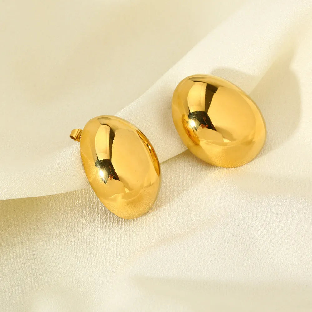 Geometric women's ear studs with a glazed gold electroplated finish and line detailing.