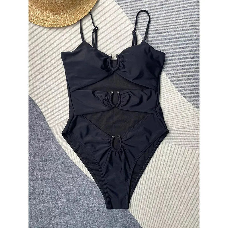 Black women's tight-fitting one-piece nylon swimsuit on a mannequin