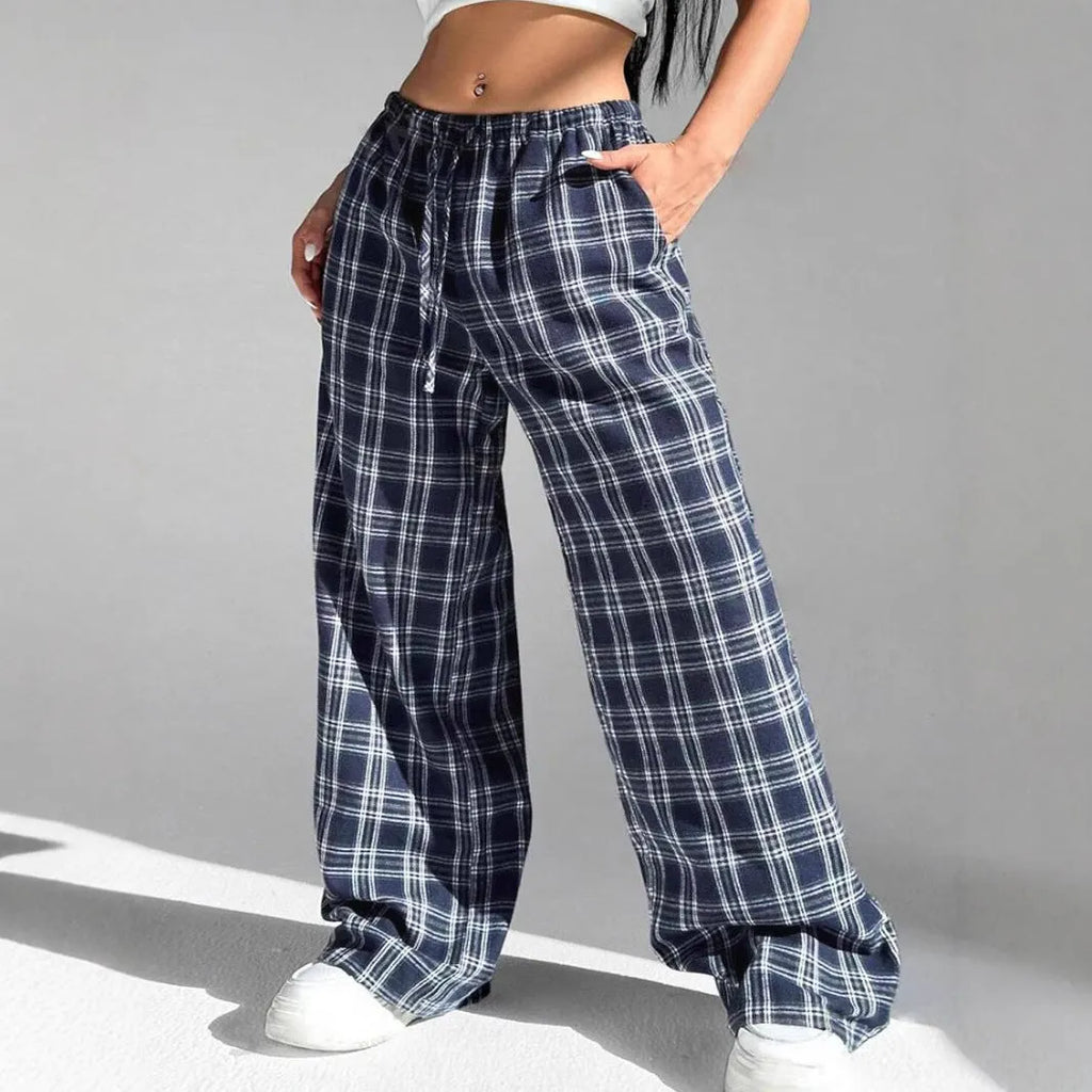 Women's loose plaid trousers with drawstring waist and side pockets in red or blue colour options