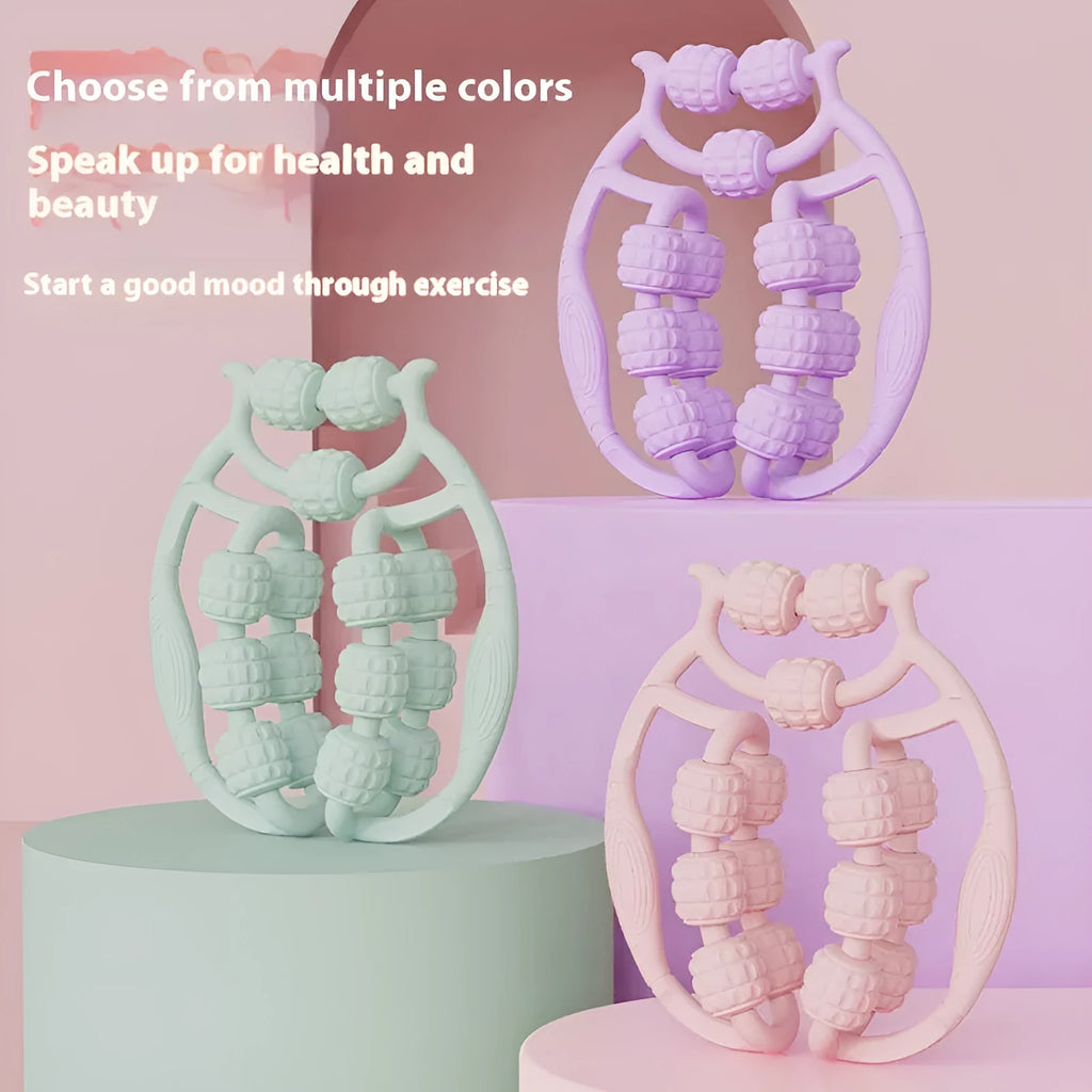 A handheld ring clip leg massage roller with double-row wheels, shown in coral pink.