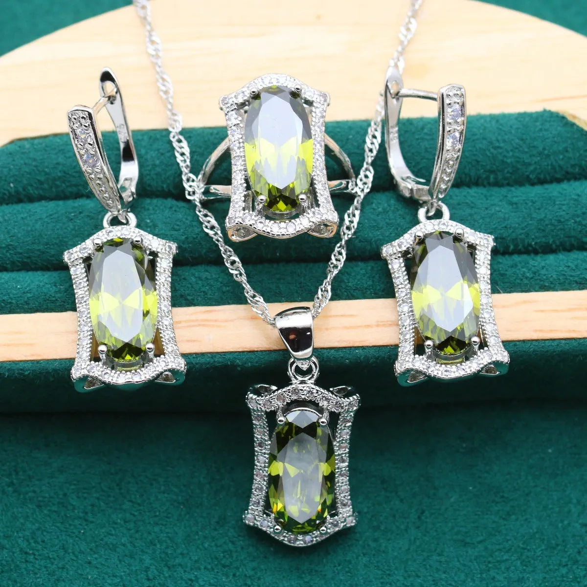 Women's anti-allergy zircon jewellery set in yellow with necklace, earrings, ring, and bracelet on display.