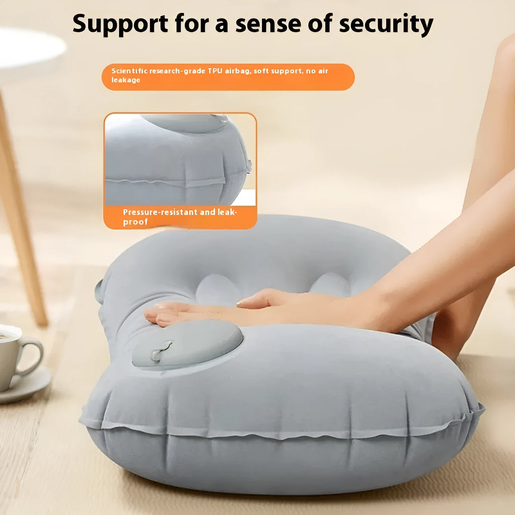 Grey inflatable travel pillow with flocking surface, shown inflated to 45x30x13cm size.