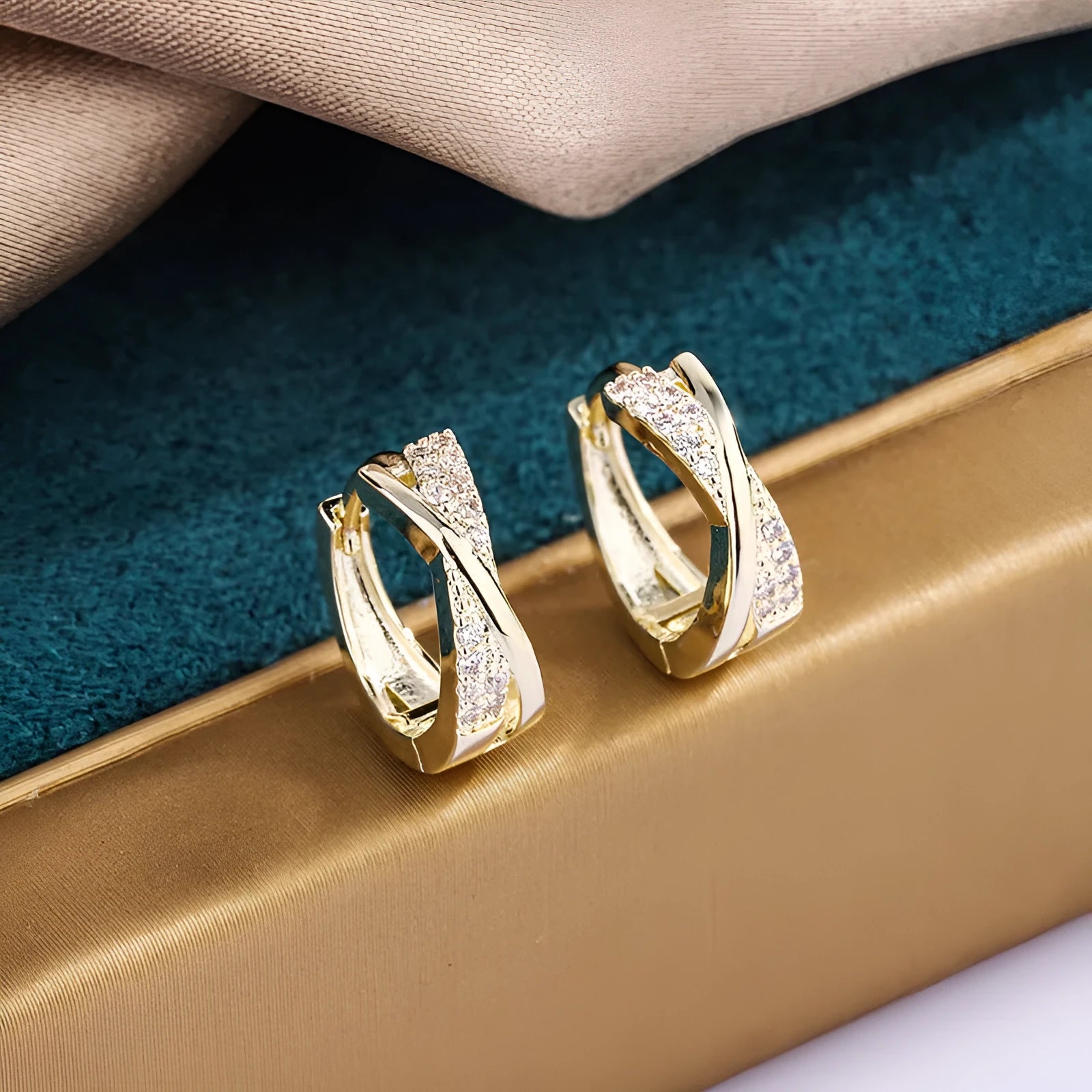 Geometric shape earrings with zircon detail and 14K yellow gold finish on copper