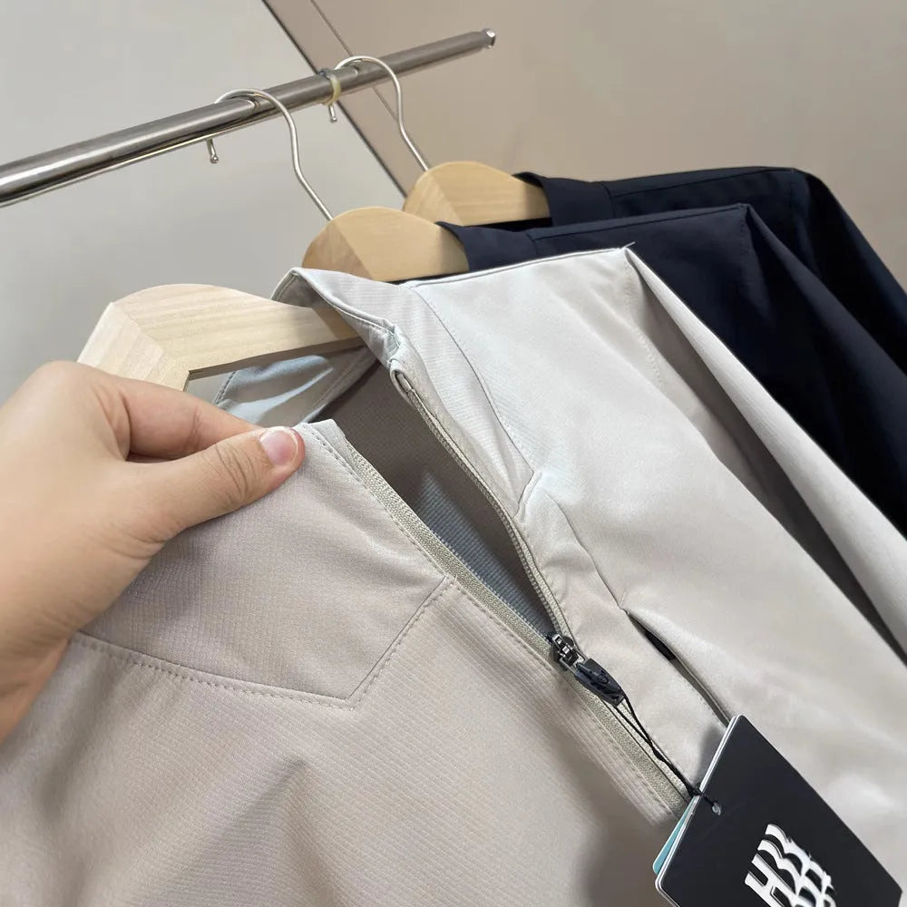 Men's stand collar casual jacket in polyester, shown in black, dark blue, and beige.