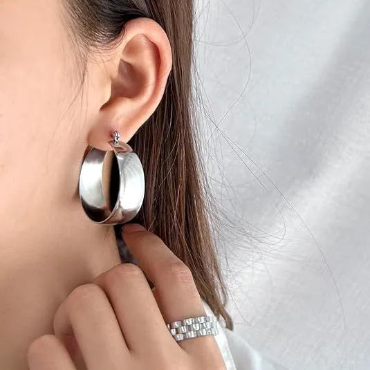 Widened curved stainless steel earrings in gold or steel colour with 25mm and 30mm size options