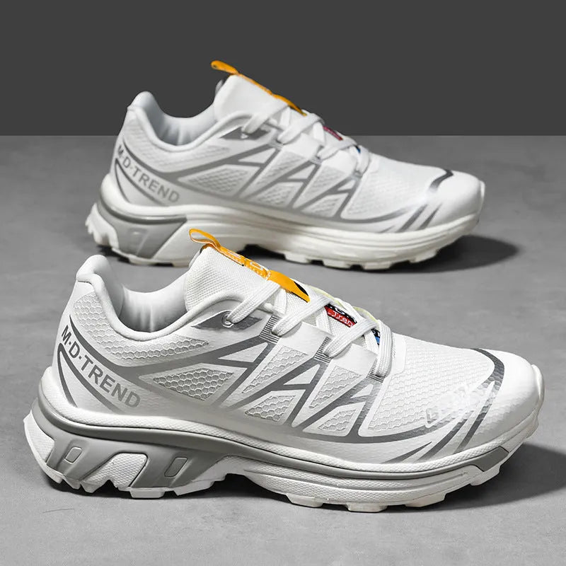 Low-top lace-up hiking shoe in khaki with a rubber sole and mesh lining detail.