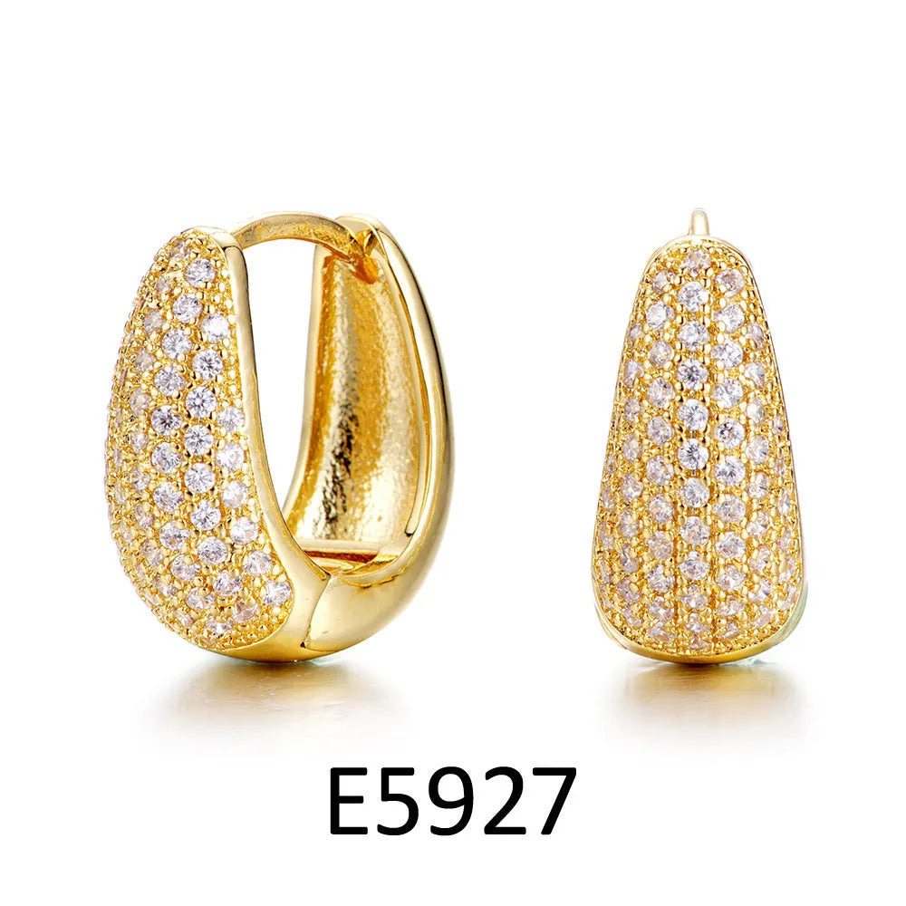 Brass gold plated heart-shaped clip earrings with gang drill zircon detail on copper base
