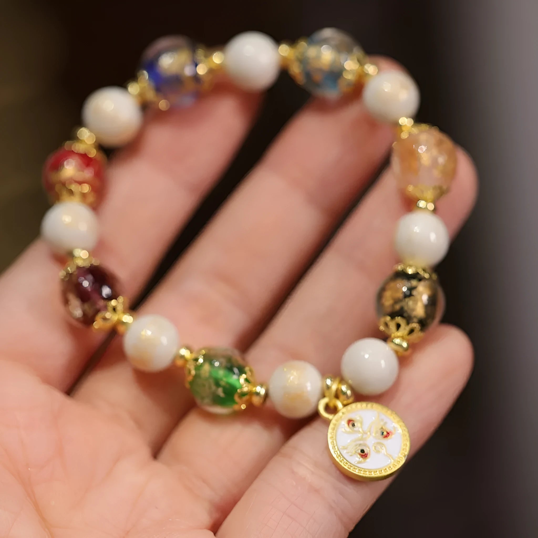 Handmade glass glaze bracelet with Five Gods of Wealth design on 10mm geometric beads.