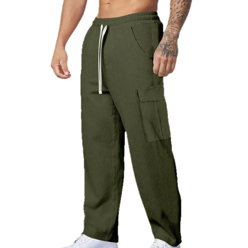 Men's loose-fitting corduroy cargo trousers in navy blue with a drawstring waist and straight wide legs.