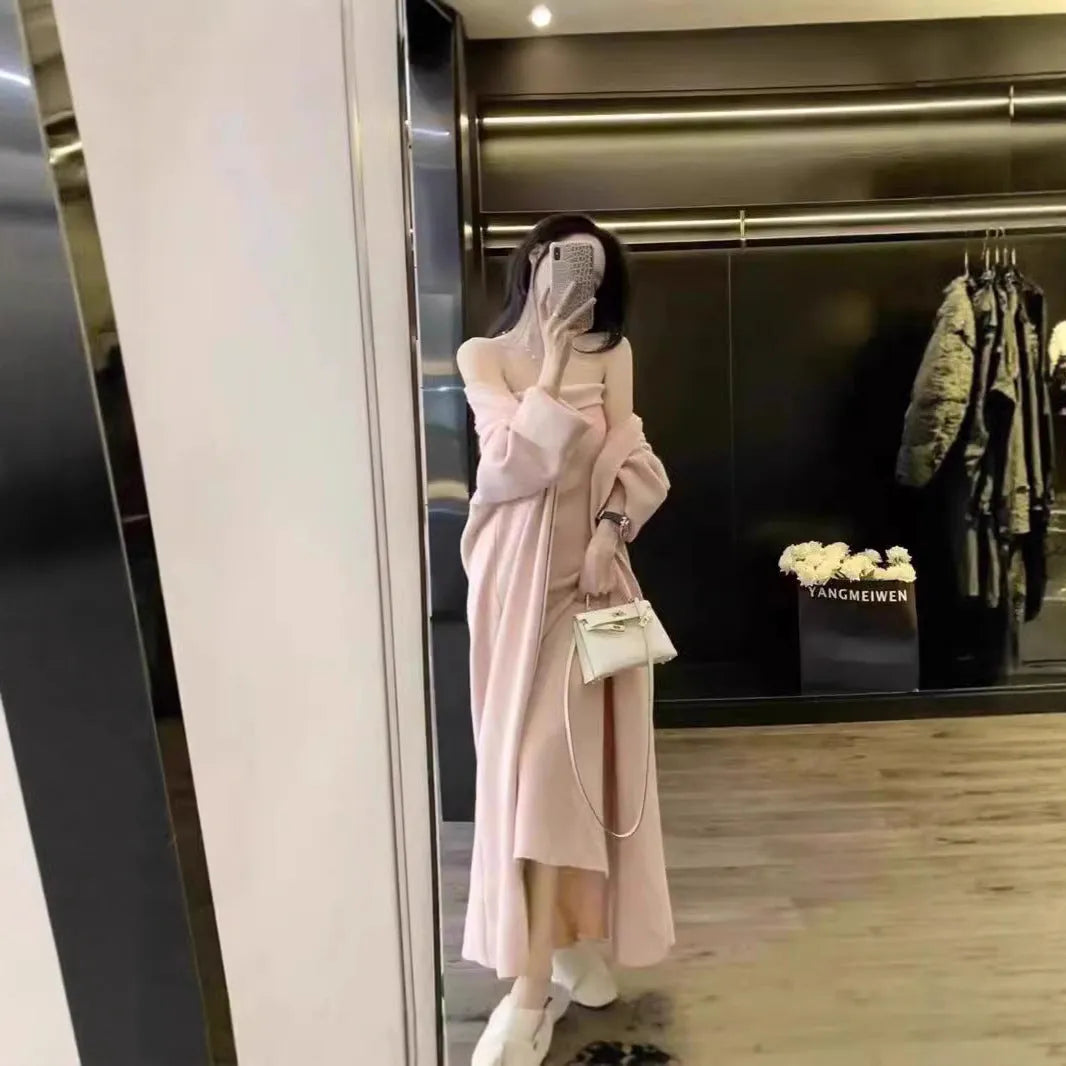 Women's grey knitted cardigan and long skirt suit set with flocking texture detail.