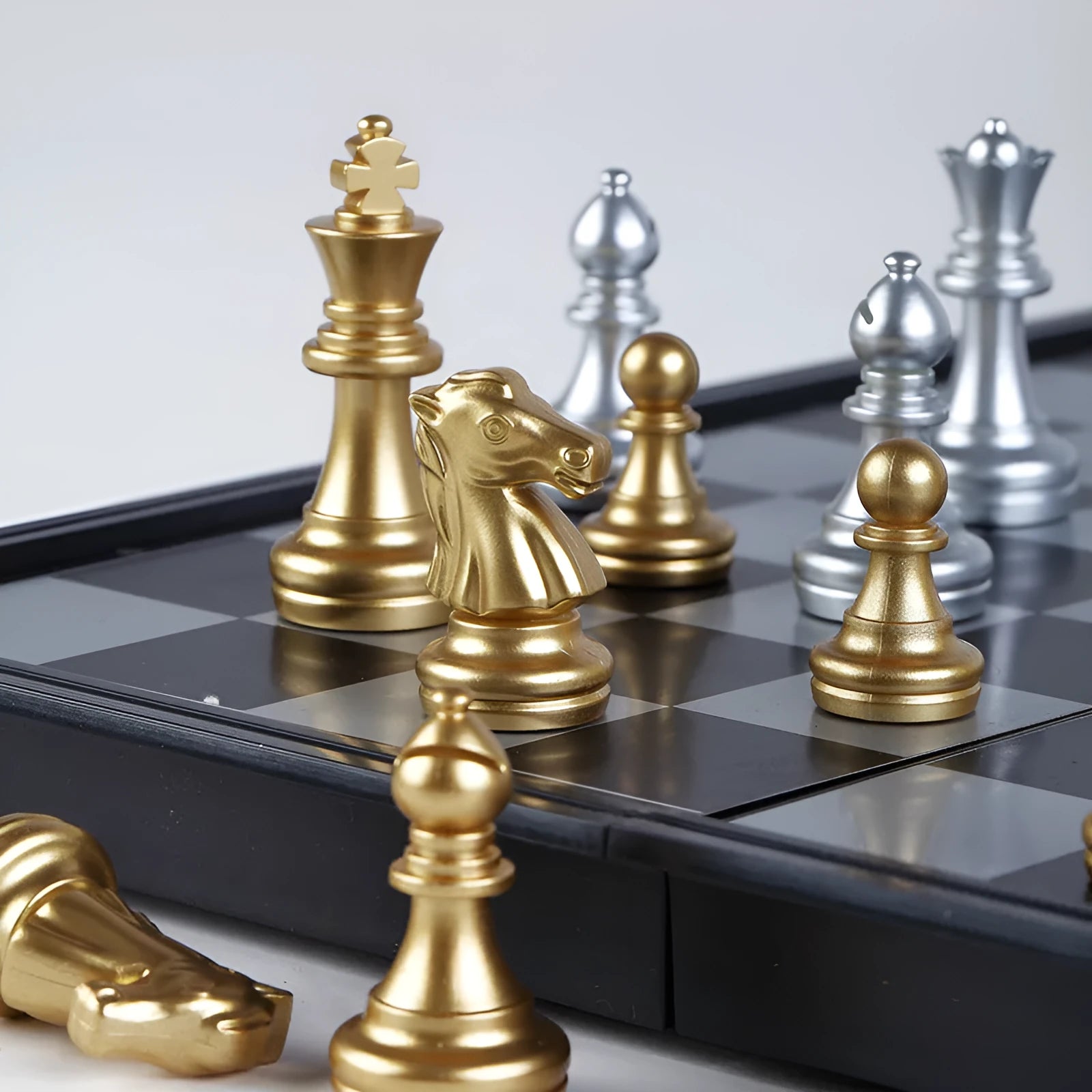 Portable folding ABS chessboard in 32cm size on a table