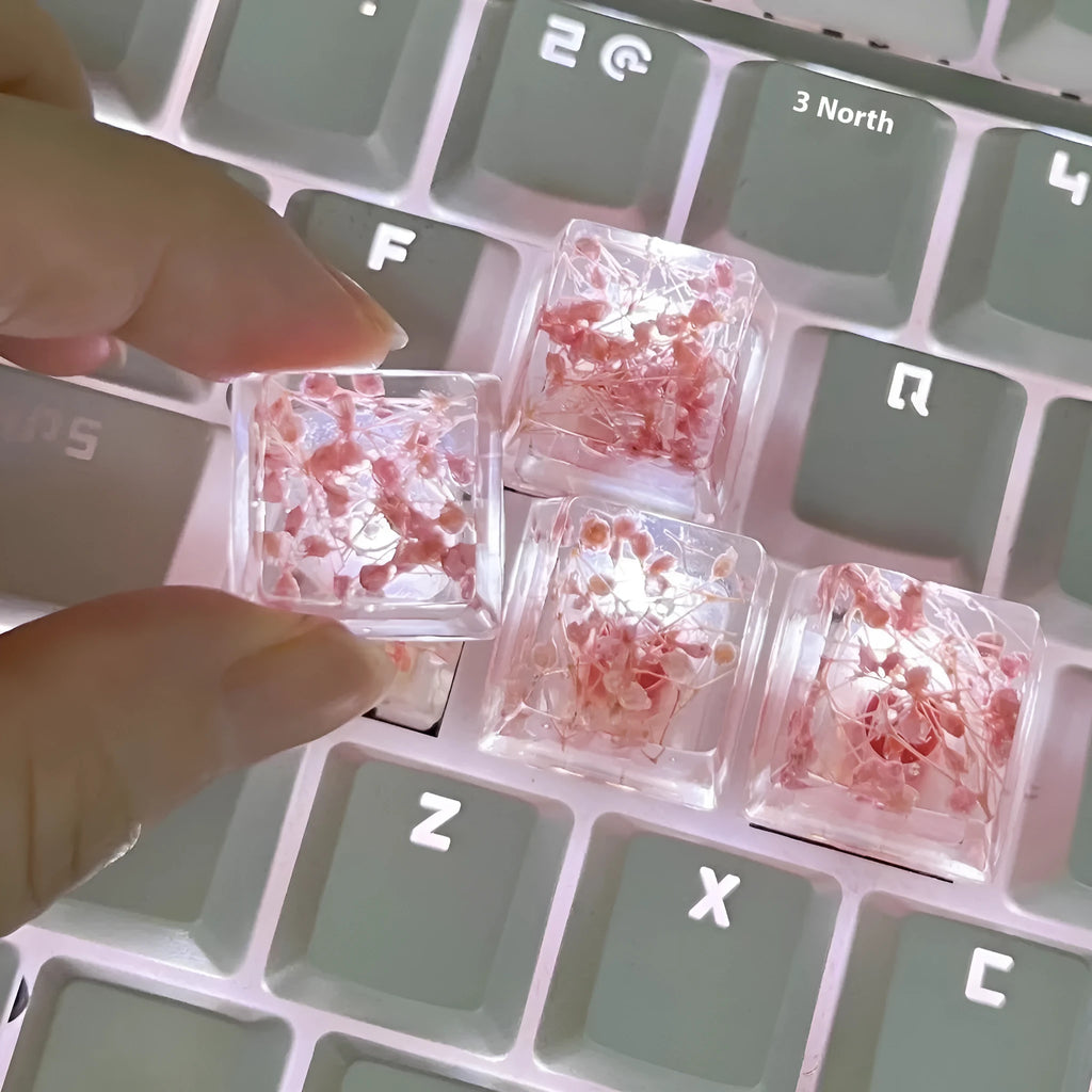 Transparent resin keycap with glitter particles creating starry night effect for mechanical keyboards