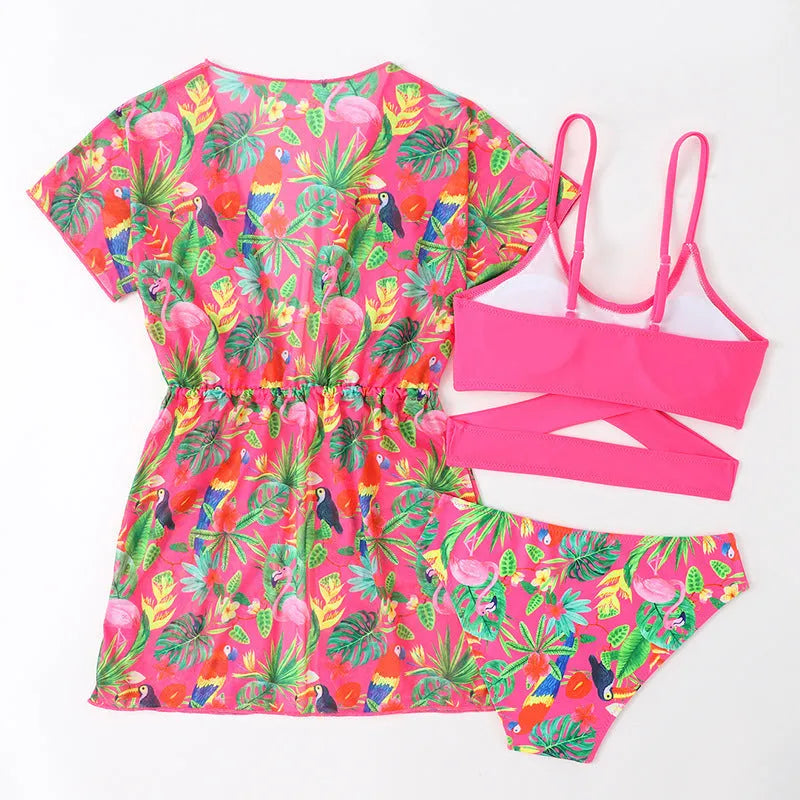 Girls floral print bikini swimsuit on hanger, showing two-piece design and overlay detail.