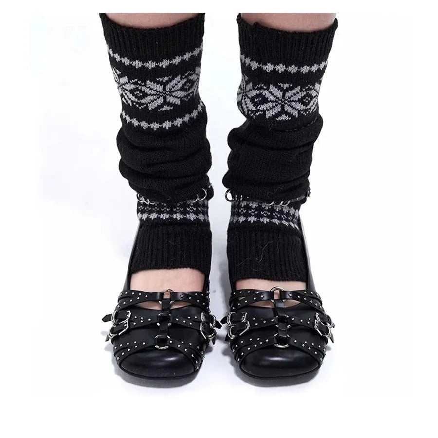 Women's black patent leather retro pumps with a buckle and low flat heel on a white background.