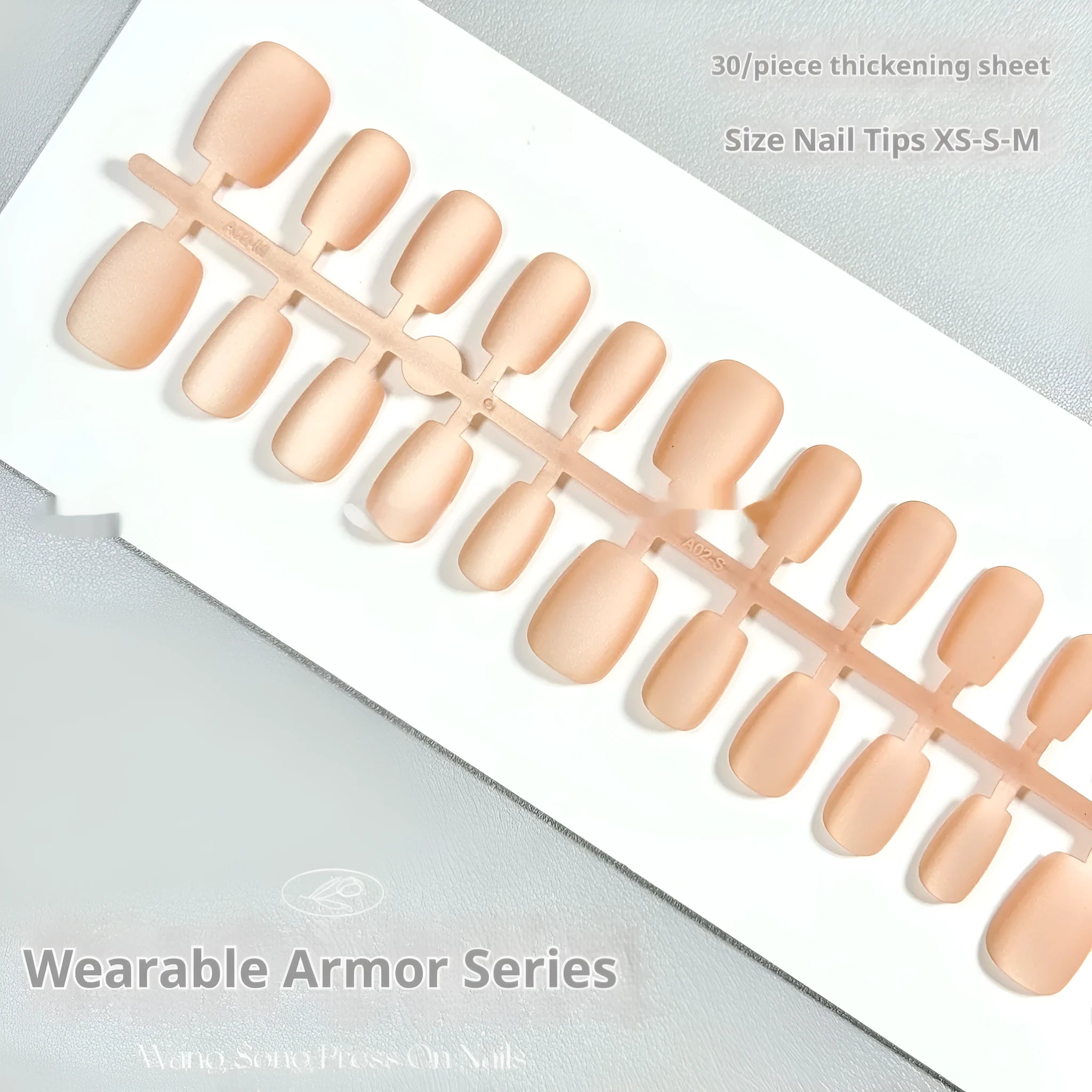 Set of velvet frosted cat's eye aurora effect false nails in short ladder sizes XS, S, and M on a white background.