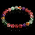 Natural strawberry quartz gemstone bracelet with round geometric beads.
