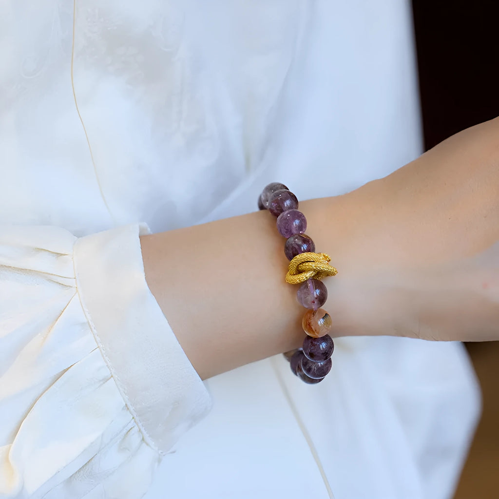Purple crystal bracelet with nine charms, animal zodiac motifs, and 10mm beads