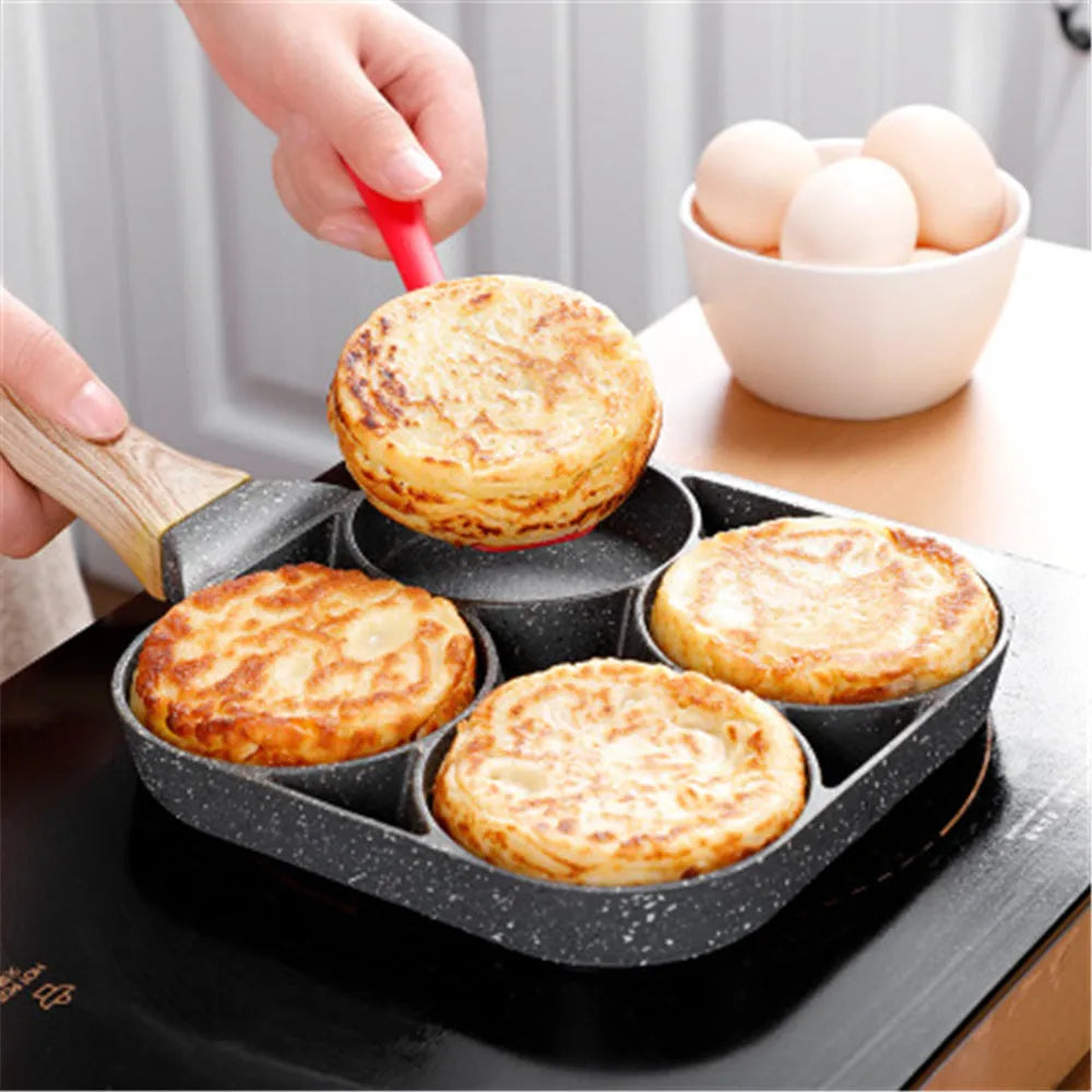 Four-hole non-stick aluminium frying pan for eggs, burgers and pancakes on a kitchen hob