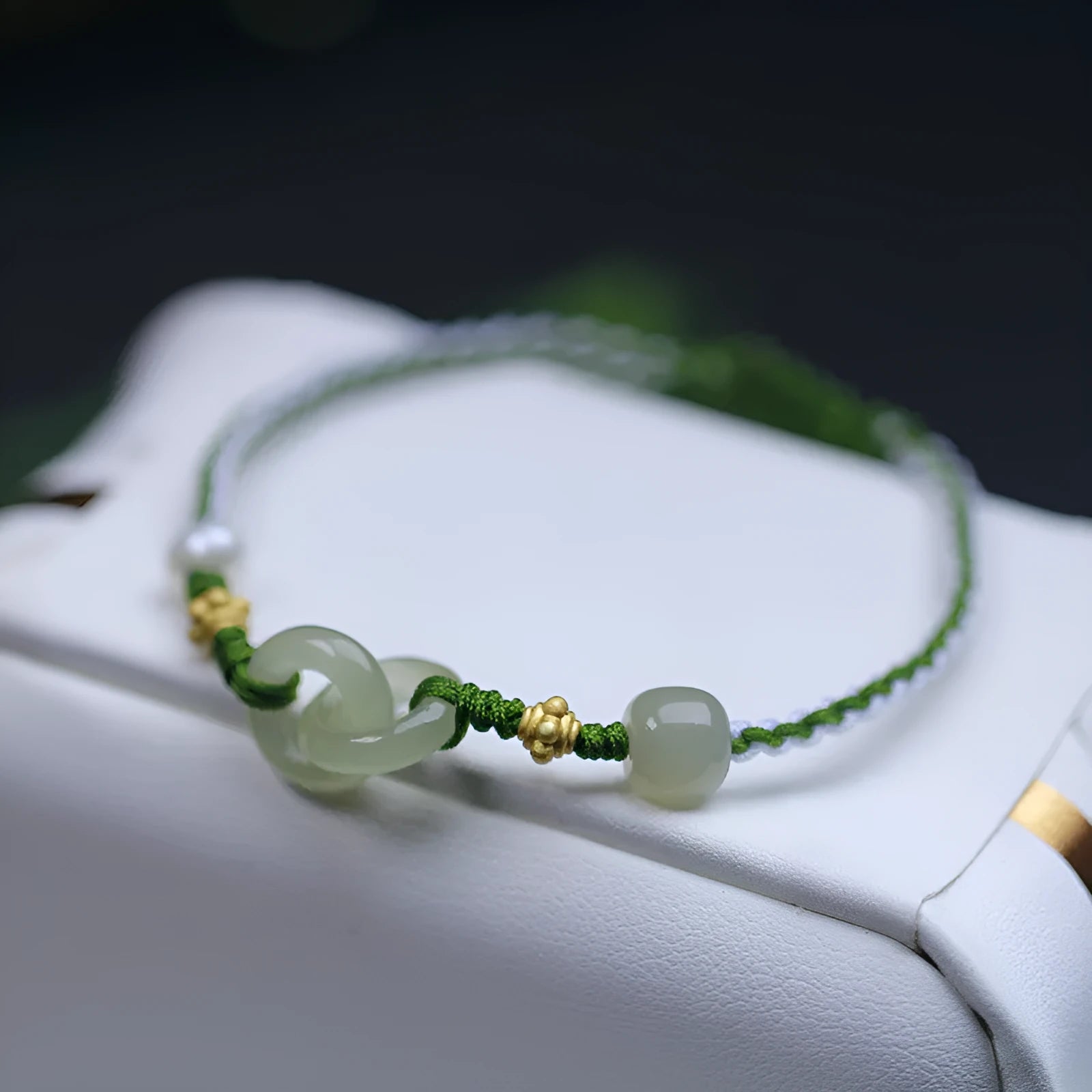 DIY woven bracelet kit showing Hetian jade beads, flexible wire, and silver or gold plated clasps for jewellery making