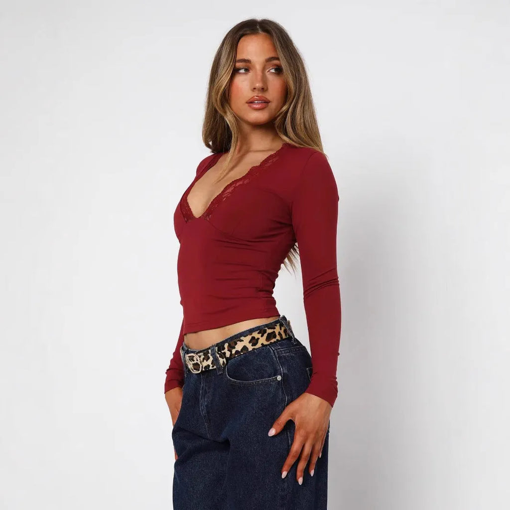 Women's slim fit lace flower top in black with long sleeves and pullover design