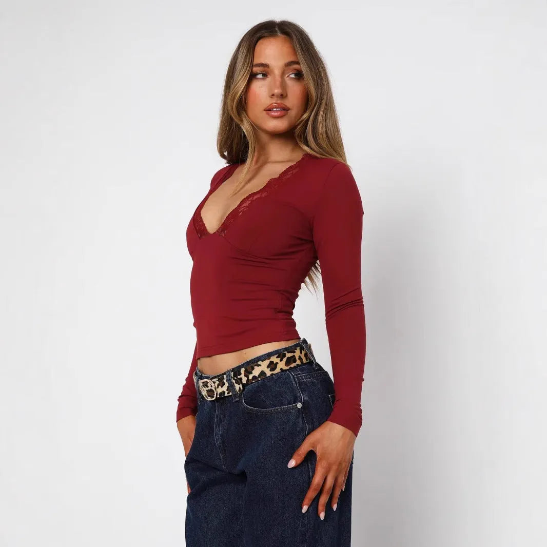 Women's slim fit lace flower top in black with long sleeves and pullover design