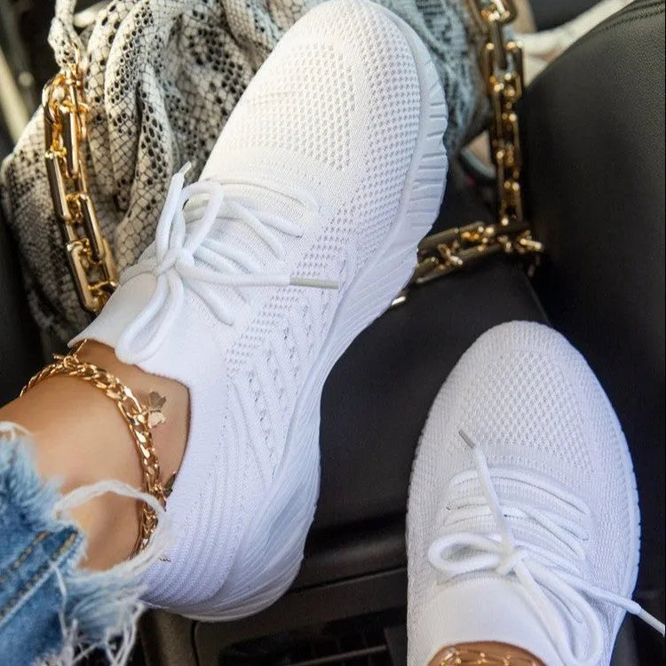 Women's thick-soled solid colour dad sneaker in multiple colour options on a white background.