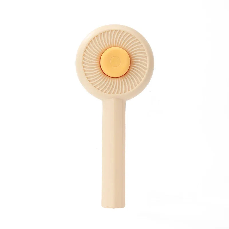 Blue pet grooming brush with angled bristles and self-cleaning button for cats and dogs
