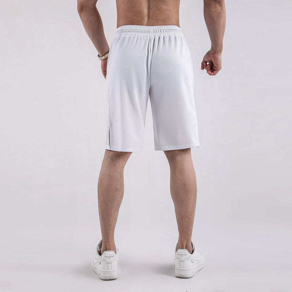 Man wearing loose black quick-dry polyester fitness shorts with an elastic waistband.