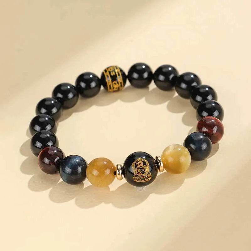 Handmade black agate bracelet with zodiac animal charms and gold tiger eye beads on wrist