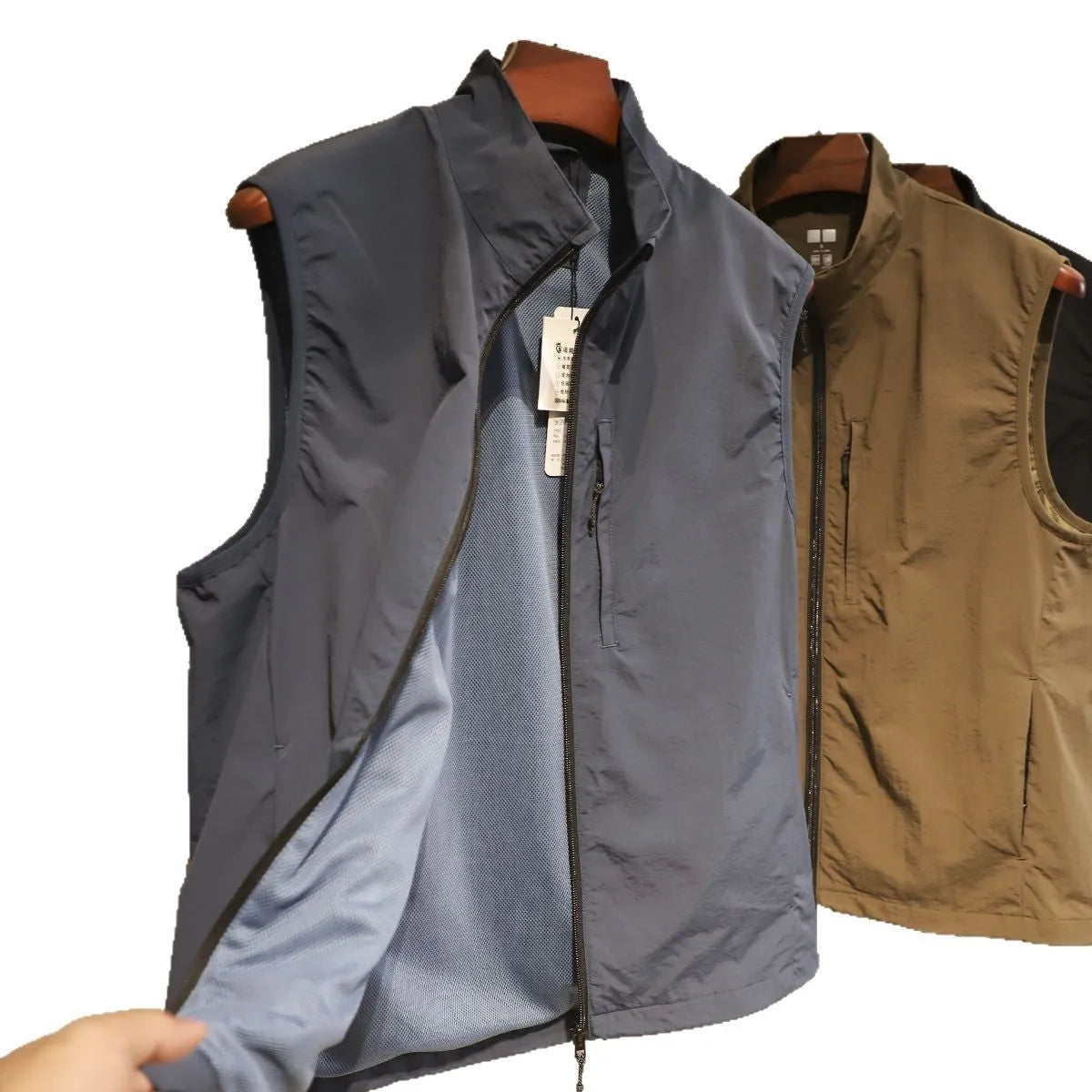 Men's solid colour nylon vest with side pockets in a straight, cardigan-style cut.