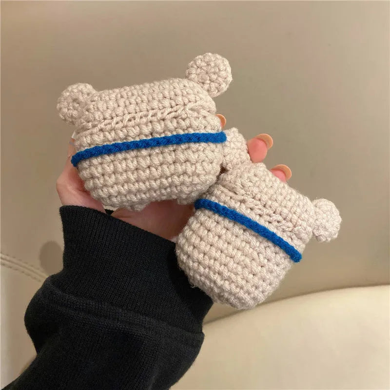 Handmade knitted grey koala bear backpack design cover on an Apple AirPods Pro charging case.
