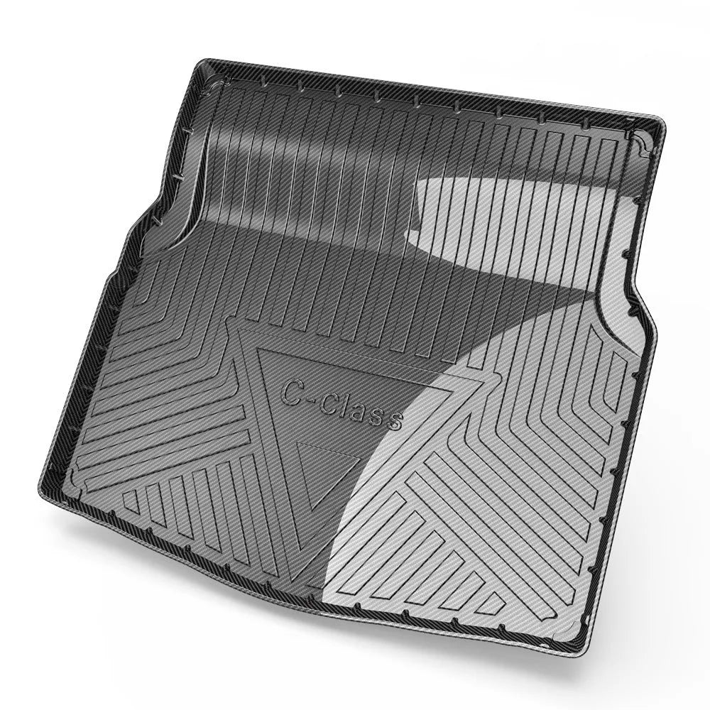 Black carbon fibre pattern TPE car boot liner mat for vehicle cargo protection.