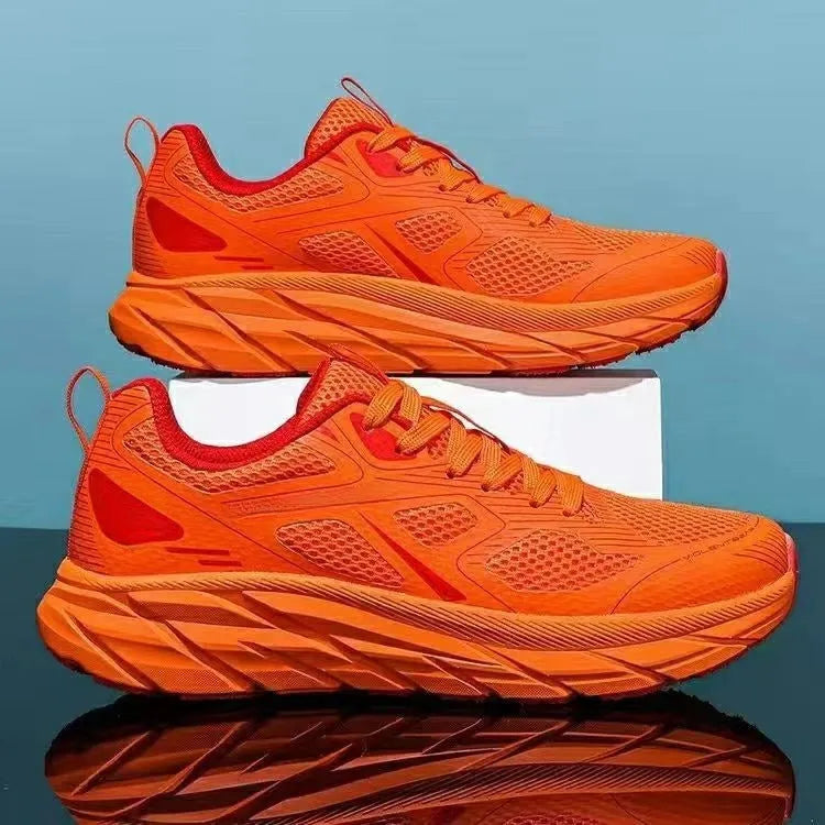 Pair of beige mesh casual running shoes with round toe and plastic sole on a white background.