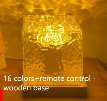 LED water ripple projection night light with remote control on wooden table