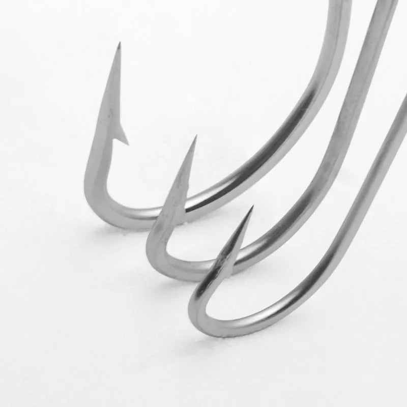 Pack of multi-style alloy fishhooks for saltwater fishing against a blue background.