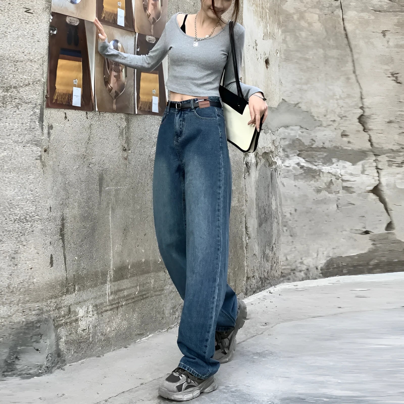 Women's retro blue high waist straight leg jeans on a hanger, showing the classic denim cut.