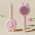 Green self-cleaning cat brush with release button and metal comb for pet grooming