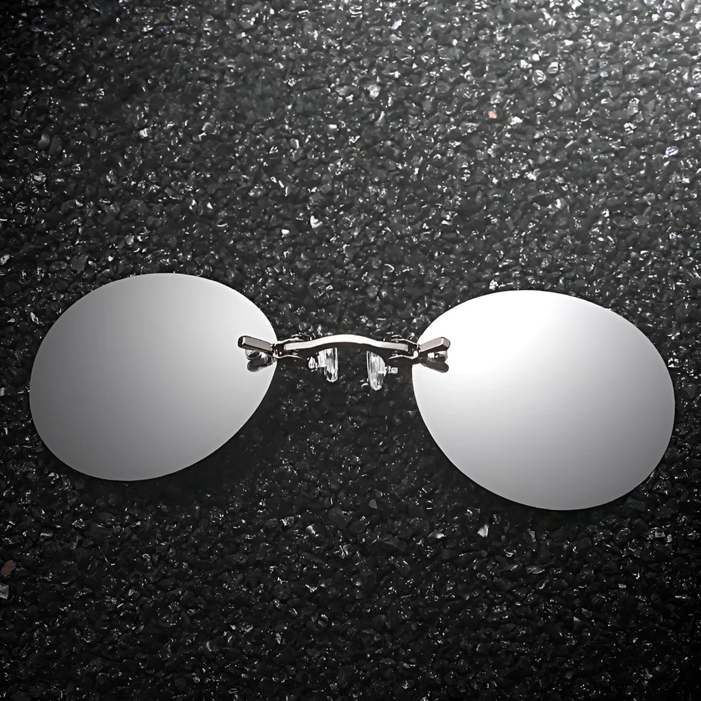 Frameless clip-nose round sunglasses in retro style with metal frame on a person
